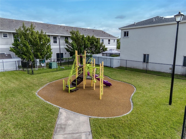 view of play area featuring a lawn