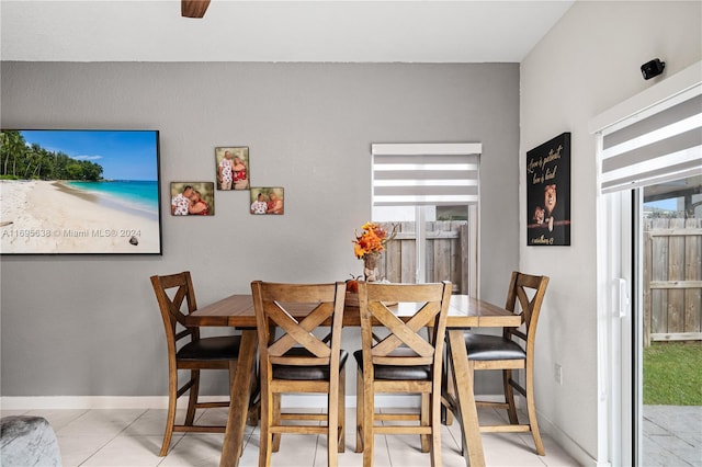 dining area with plenty of natural light and light tile patterned floors