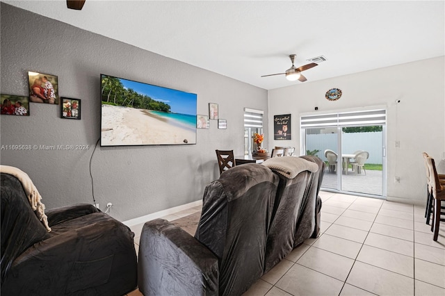 interior space with ceiling fan and light tile patterned flooring