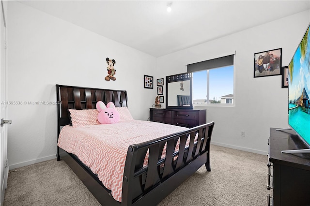 bedroom featuring light carpet