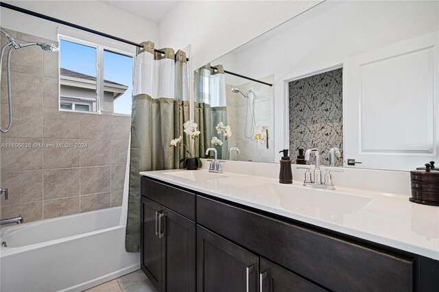 bathroom featuring tile patterned floors, vanity, and shower / tub combo