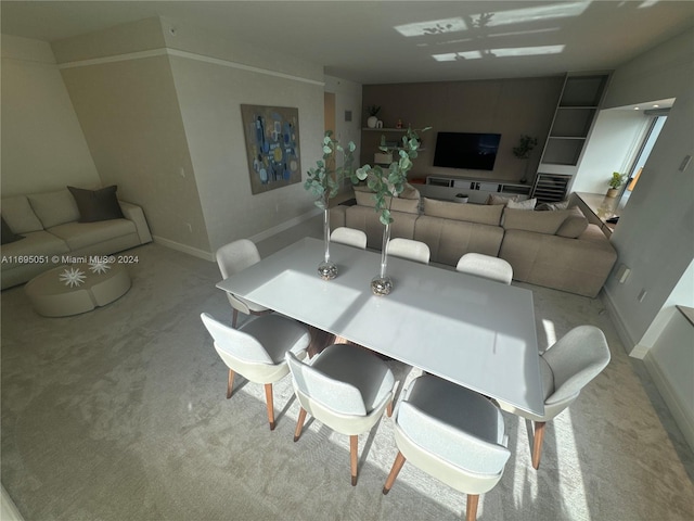 dining area with light colored carpet