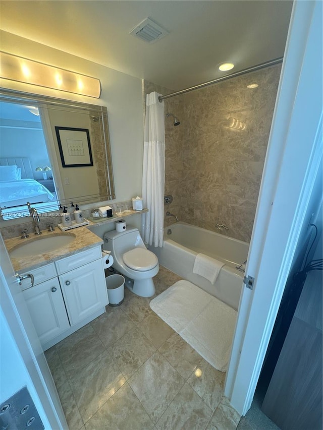 full bathroom with vanity, toilet, and shower / bath combo with shower curtain