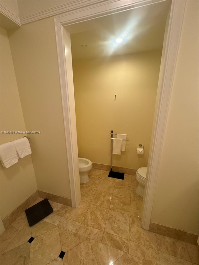 bathroom featuring a bidet and toilet