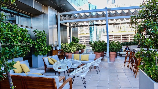 view of patio / terrace with a pergola and an outdoor hangout area