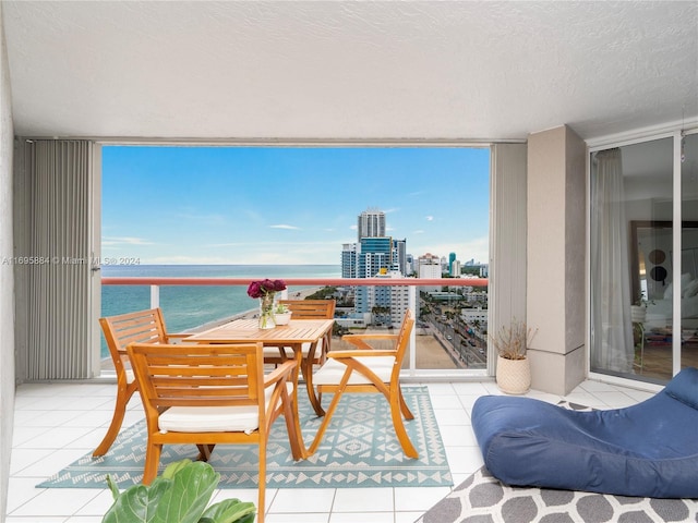 balcony featuring a water view