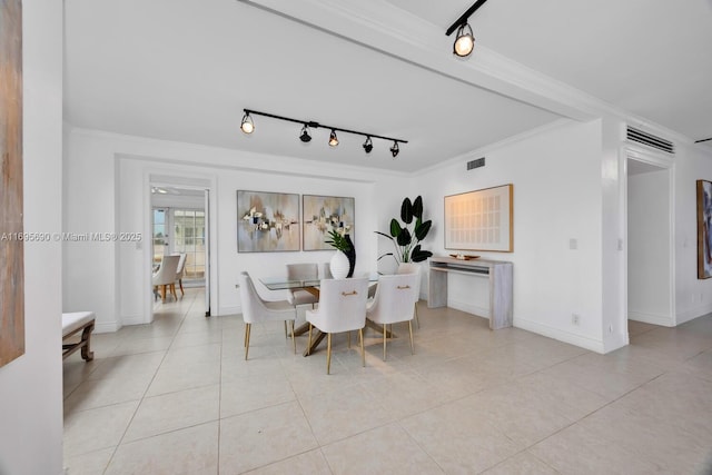 dining area featuring baseboards, visible vents, ornamental molding, and light tile patterned flooring