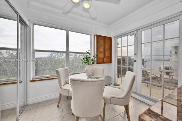 sunroom featuring ceiling fan