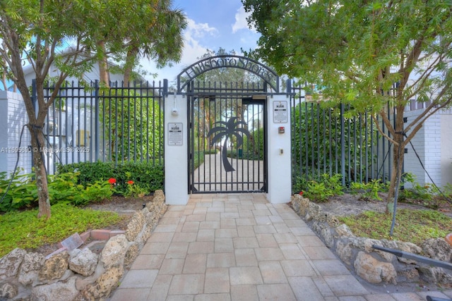 view of gate with fence