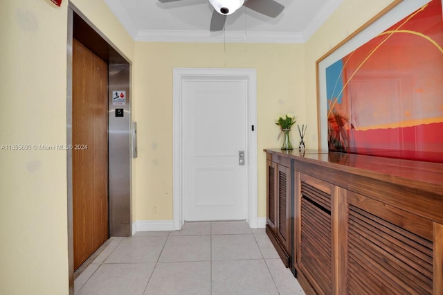 corridor with elevator, light tile patterned floors, and ornamental molding