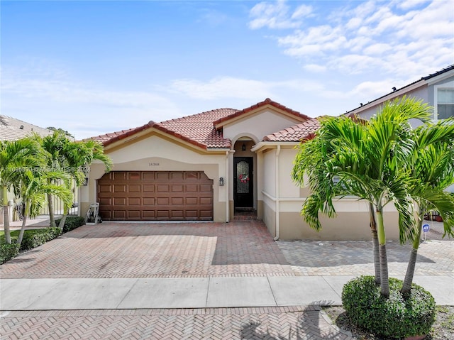 mediterranean / spanish-style home featuring a garage