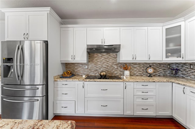 kitchen featuring stainless steel refrigerator with ice dispenser, black electric cooktop, white cabinetry, and dark wood-type flooring