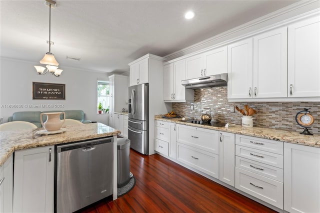 kitchen with dark hardwood / wood-style flooring, ornamental molding, stainless steel appliances, decorative light fixtures, and white cabinets