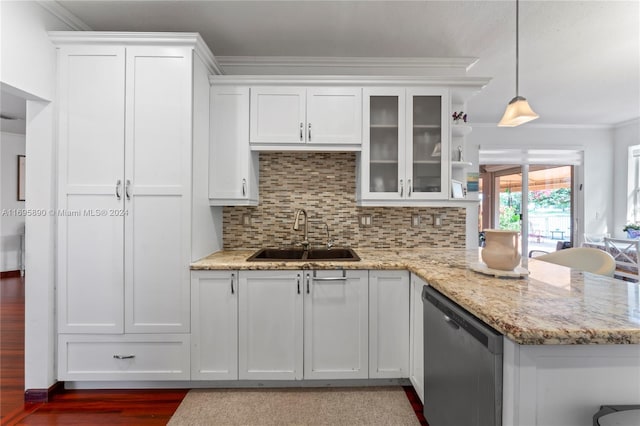 kitchen with dishwasher, pendant lighting, white cabinets, and sink