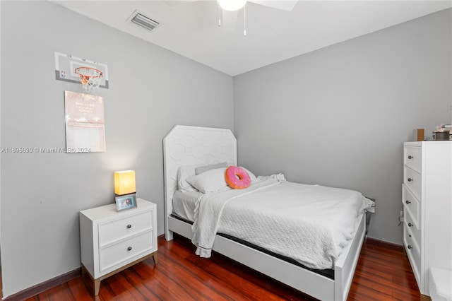 bedroom featuring dark hardwood / wood-style floors and ceiling fan