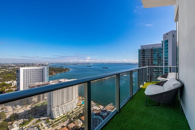 balcony featuring a water view