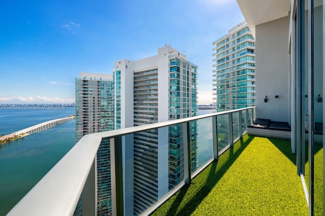 balcony featuring a water view