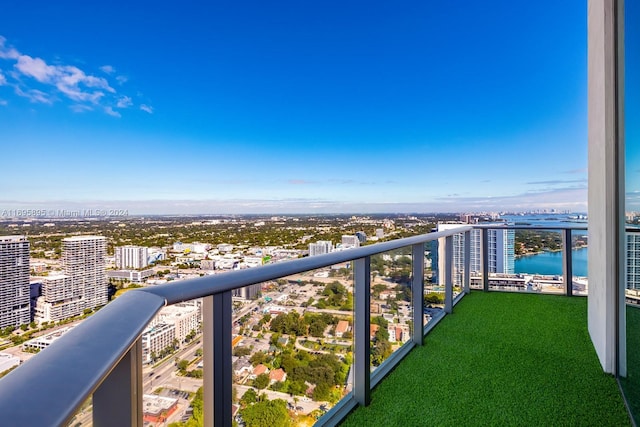 balcony featuring a water view