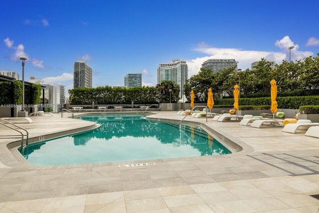 view of swimming pool featuring a patio