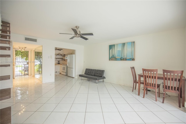 dining area with ceiling fan and light tile patterned floors