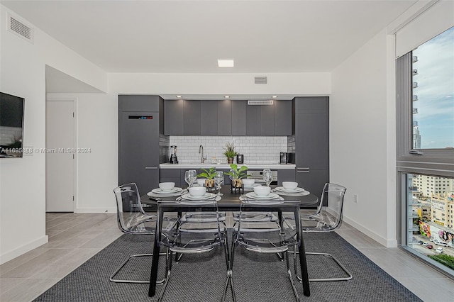 tiled dining area with sink