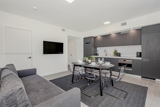 interior space featuring light tile patterned floors and sink