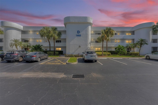 view of outdoor building at dusk