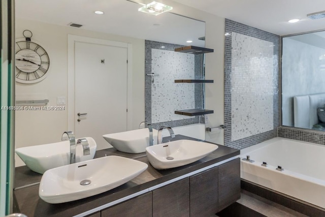 bathroom with plus walk in shower and vanity