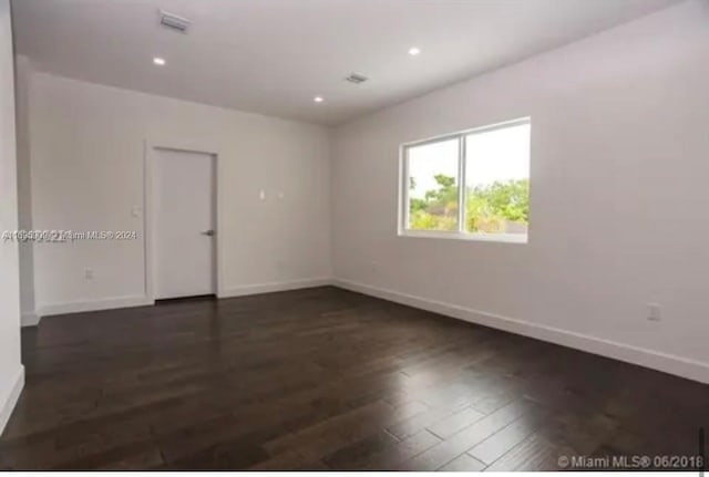 empty room featuring dark hardwood / wood-style floors