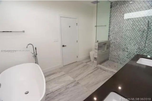 bathroom with sink and plus walk in shower