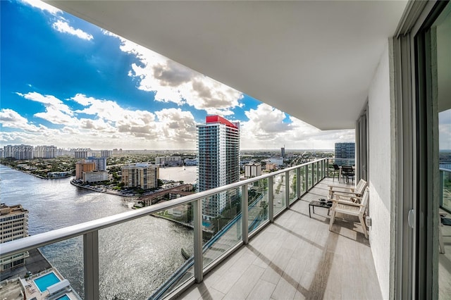 balcony featuring a water view