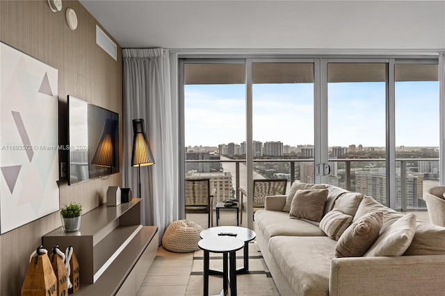 living room featuring floor to ceiling windows and light hardwood / wood-style flooring