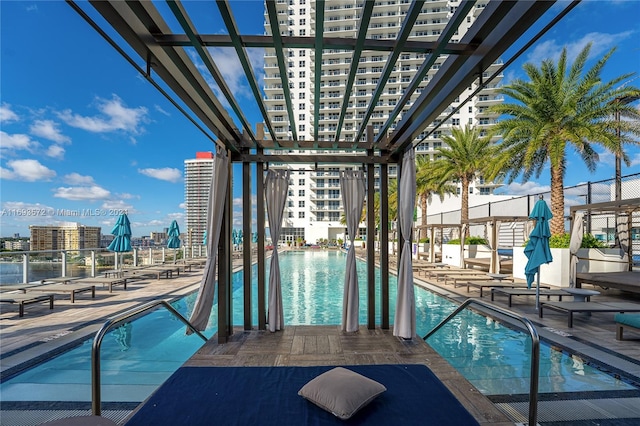 view of swimming pool with a pergola