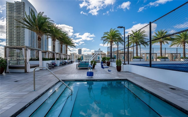 view of swimming pool featuring a patio