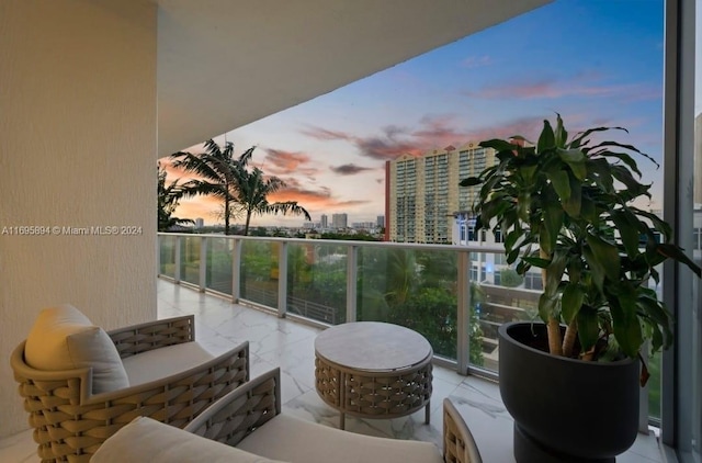 view of balcony at dusk