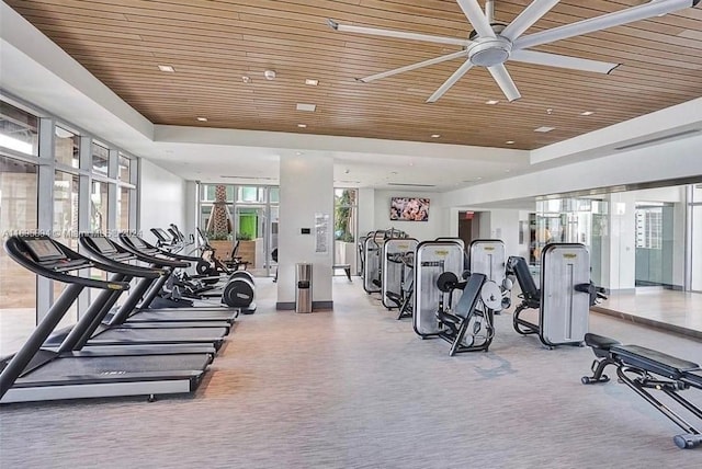 workout area with ceiling fan and wood ceiling