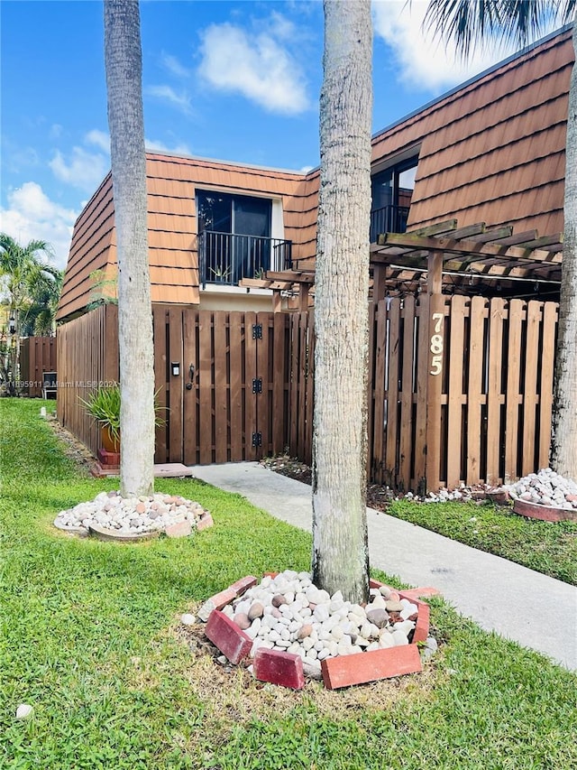 view of home's exterior with a lawn