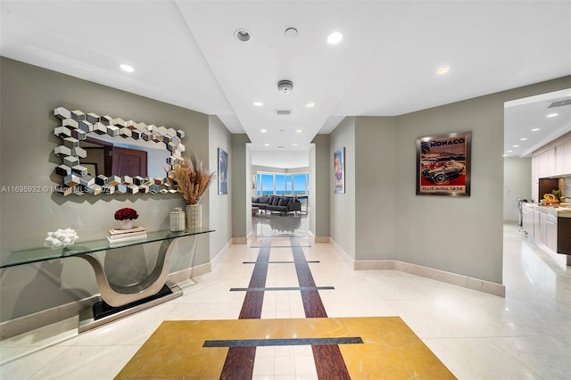 hallway with light tile patterned floors