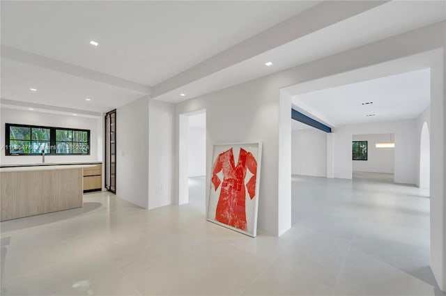 hall featuring light tile patterned floors