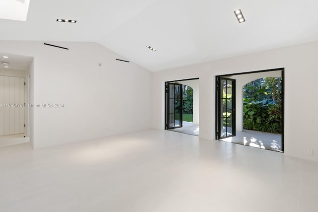 spare room with lofted ceiling