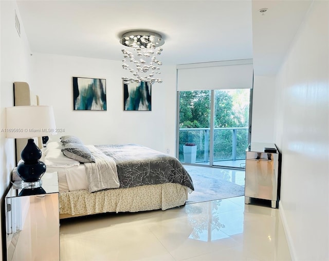 17301 Biscayne Blvd Unit 208, North Miami Beach, FL 33160 - tiled bedroom featuring a chandelier and access to exterior