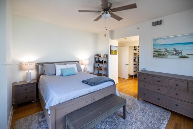 7275 SW 90th St Unit C212, Miami, FL 33156 - bedroom featuring wood finished floors, a walk in closet, ceiling fan, and a closet