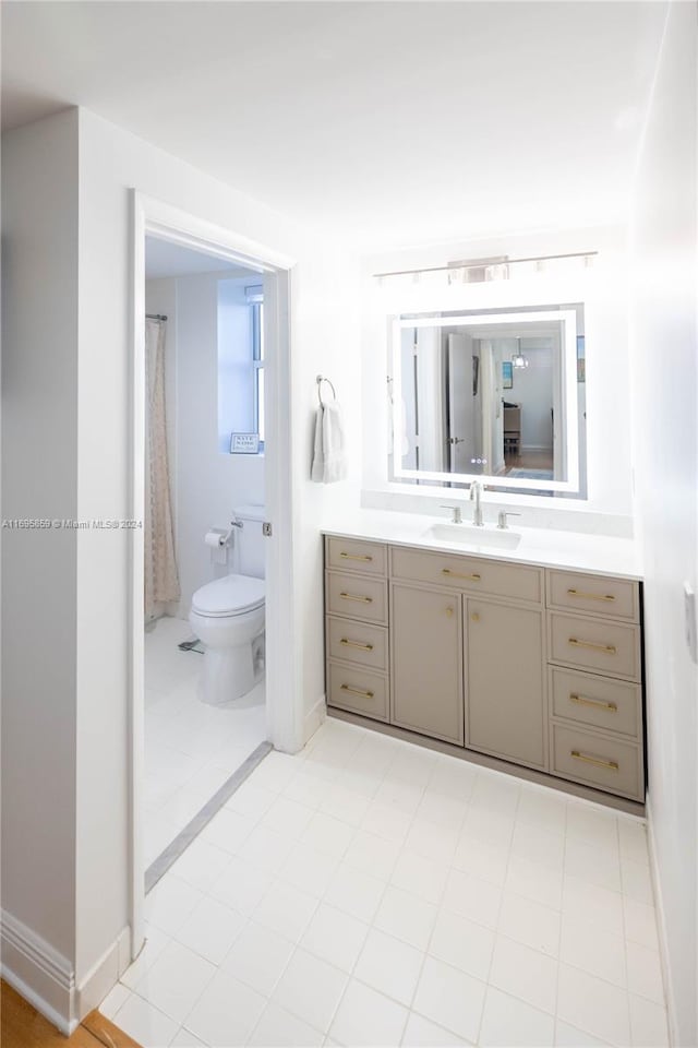 7275 SW 90th St Unit C212, Miami, FL 33156 - bathroom featuring toilet, vanity, and baseboards