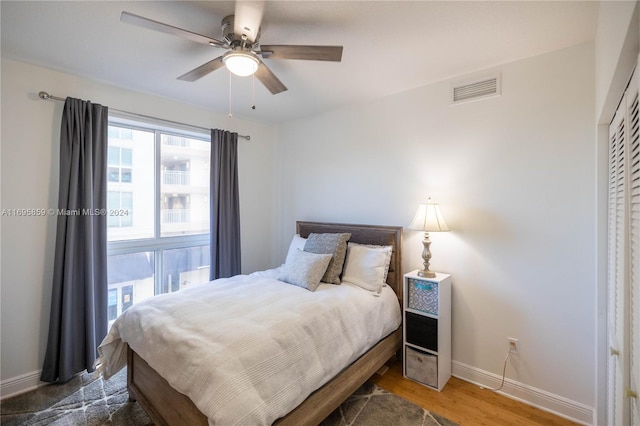 bedroom featuring dark hardwood / wood-style floors and ceiling fan