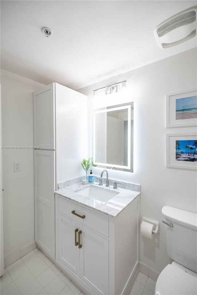 7275 SW 90th St Unit C212, Miami, FL 33156 - bathroom with baseboards, toilet, vanity, and tile patterned flooring