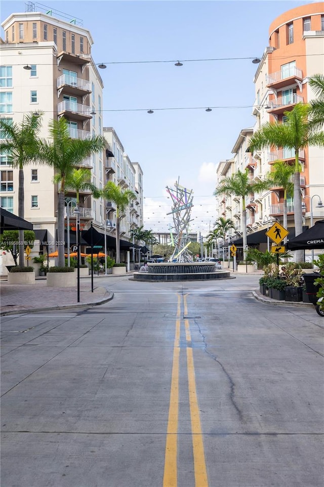 7275 SW 90th St Unit C212, Miami, FL 33156 - view of road featuring traffic signs, curbs, street lighting, and sidewalks