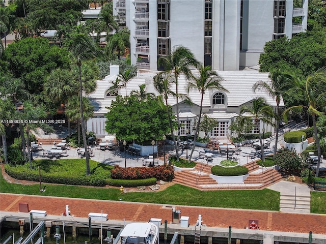 view of community featuring a patio area and a boat dock