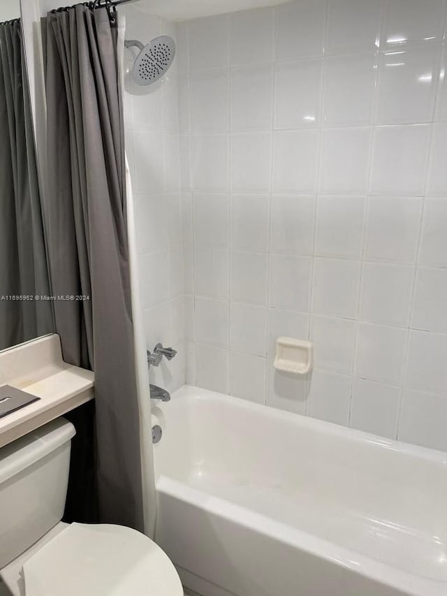 full bathroom with vanity, toilet, and shower / bathtub combination with curtain