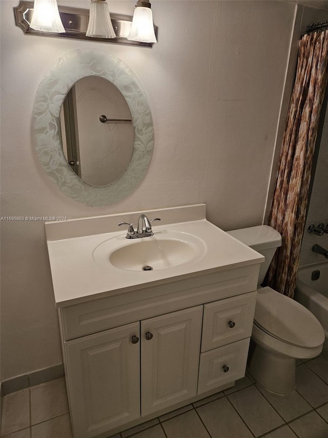 full bathroom featuring tile patterned flooring, vanity, shower / tub combo, and toilet