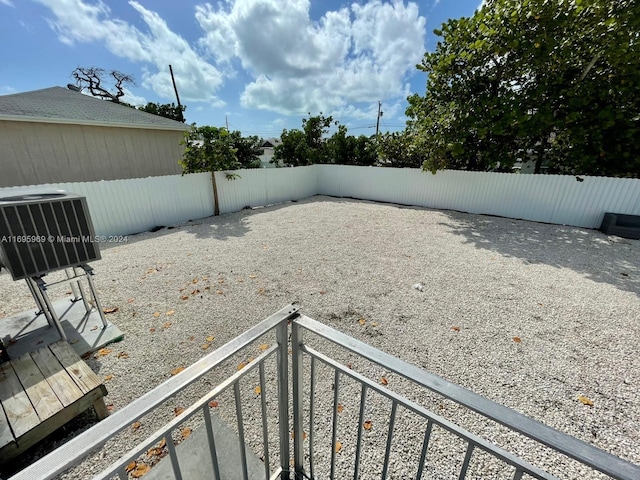 view of yard featuring central air condition unit